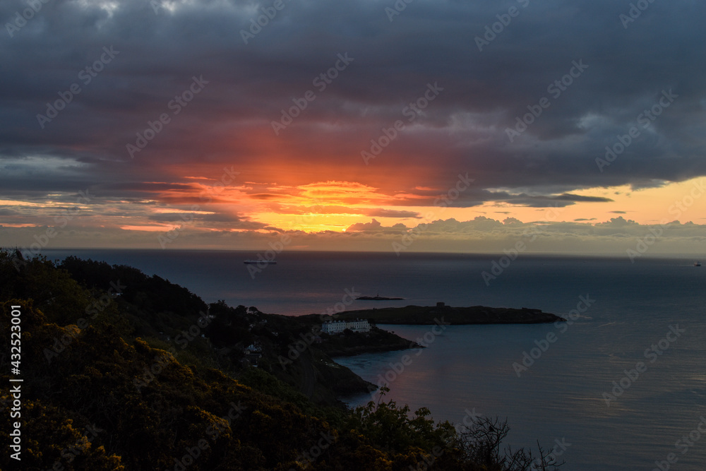 Dawn Sunrise over from Killiney hill in Dublin Ireland. Walking from Darkness into light. 