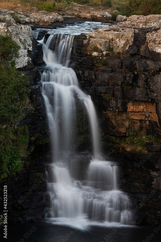 Beautiful slow shutter waterfall in Nelspruit South Africa, Water Cascading down a mountain side over the rocky terrain