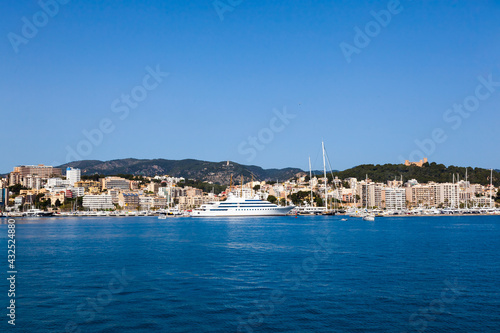 View of the bay of Palma de Mallorca with luxury yachts, buildings, mountains. © Сергей Жмурчак
