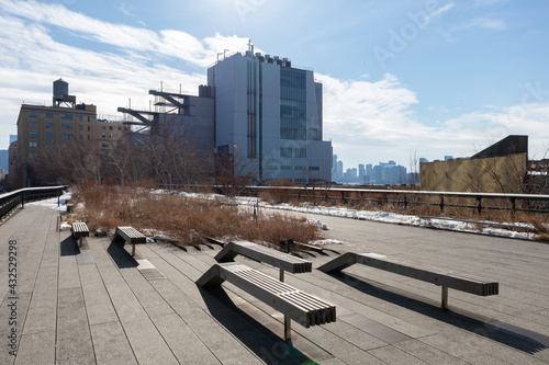 Wall Mural The High Line with Empty Benches and Snow during Winter in Chelsea of New York C