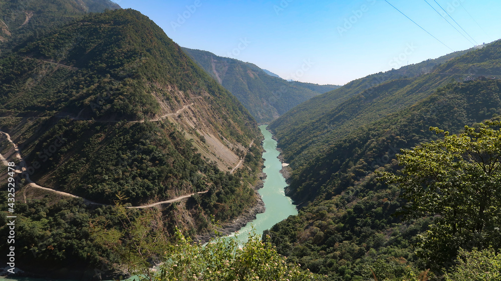 Rishikesh Valley on the Ganges river, India.
River Ganga Flowing through Hrishikesh, Uttarakhand, India