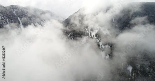 Fog in the mountains. Andorra la Vella. Aerial view. Pyrenees mountains, Andorra. Aerial. Drone video
