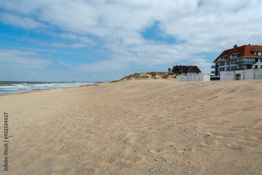Yellow sandy beach in small Belgian town Knokke-Heist, luxury vacation destination, summer holidays Yellow sandy beach in small Belgian town Knokke-Heist, luxury vacation destination, summer holidays
