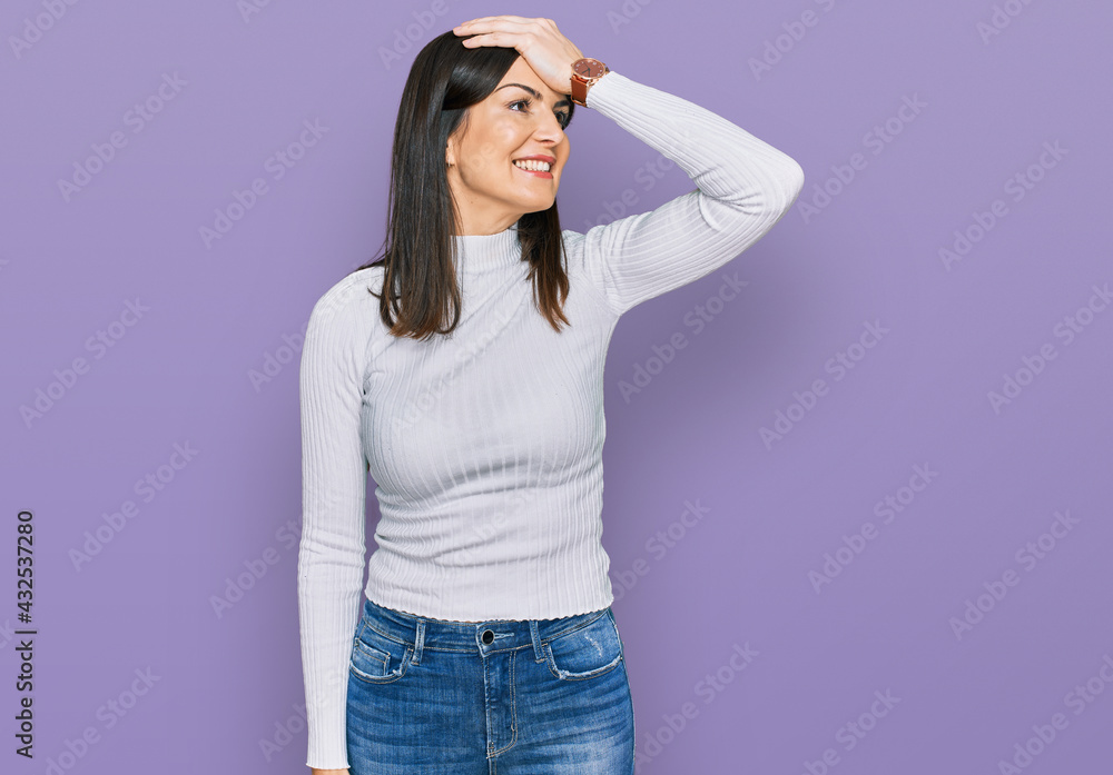 Beautiful brunette woman wearing casual clothes smiling confident touching hair with hand up gesture, posing attractive and fashionable Beautiful brunette woman wearing casual clothes smiling confident touching hair with hand up gesture, posing attractive and fashionable