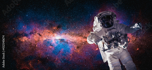 Fototapeta Naklejka Na Ścianę i Meble -  Astronaut spaceman do spacewalk while working for space station in outer space . Astronaut wear full spacesuit for space operation . Elements of this image furnished by NASA space astronaut photos.