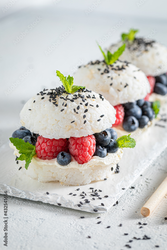 Delicious sush burger with mascarpone and berries as Japanese dessert.
