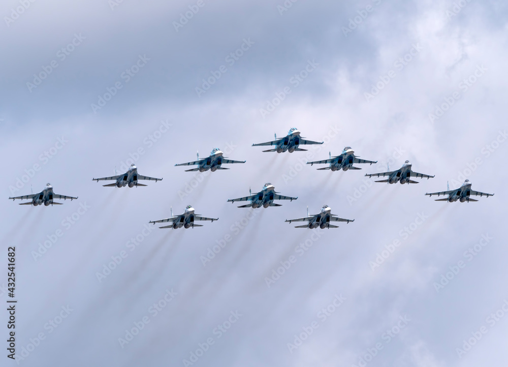 MOSCOW, RUSSIA - MAY 7, 2021: Avia parade in Moscow. su-35 and su-34 and su-30 in the sky on parade of Victory in World War II in Moscow, Russia MOSCOW, RUSSIA - MAY 7, 2021: Avia parade in Moscow. su-35 and su-34 and su-30 in the sky on parade of Victory in World War II in Moscow, Russia