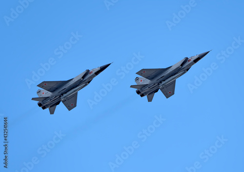MOSCOW, RUSSIA - MAY 7, 2021: Avia parade in Moscow. group jet fighter aircraft Mikoyan MiG-31 in the sky on parade of Victory in World War II in Moscow, Russia