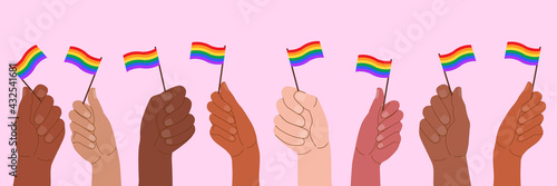 Vector illustration of hands holding flags with LGBT symbols.