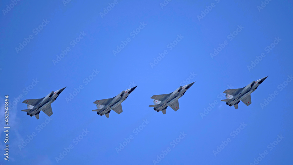 MOSCOW, RUSSIA - MAY 7, 2021: Avia parade in Moscow. group jet fighter aircraft Mikoyan MiG-31 in the sky on parade of Victory in World War II in Moscow, Russia MOSCOW, RUSSIA - MAY 7, 2021: Avia parade in Moscow. group jet fighter aircraft Mikoyan MiG-31 in the sky on parade of Victory in World War II in Moscow, Russia