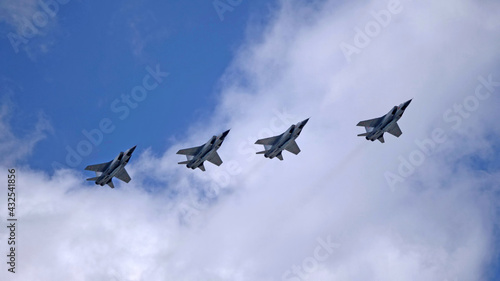 MOSCOW, RUSSIA - MAY 7, 2021: Avia parade in Moscow. group jet fighter aircraft Mikoyan MiG-31 in the sky on parade of Victory in World War II in Moscow, Russia