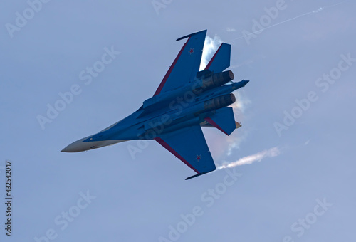 Moscow Russia Zhukovsky  Russian Knights Russkie Vityazi aerobatic team performs a demonstration flight aerobatics figures of the international aerospace salon MAKS-2019 photo