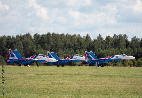 Moscow Russia Zhukovsky Russian Knights Russkie Vityazi aerobatic team performs a demonstration flight aerobatics figures of the international aerospace salon MAKS-2019