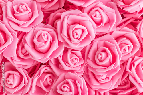 background of pink flowers. Artificial pink roses  foamiran roses. fake flowers.