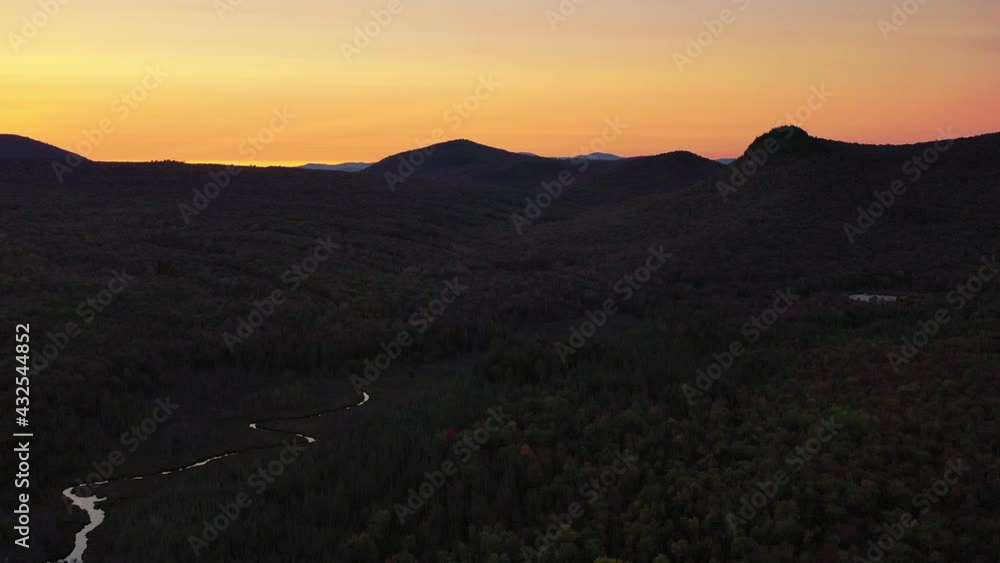 Aerial Shot Of Forest Against Sunset Sky During Autumn, Drone Flying Downward Over Landscape - Lake Groton, Vermont Aerial Shot Of Forest Against Sunset Sky During Autumn, Drone Flying Downward Over Landscape - Lake Groton, Vermont