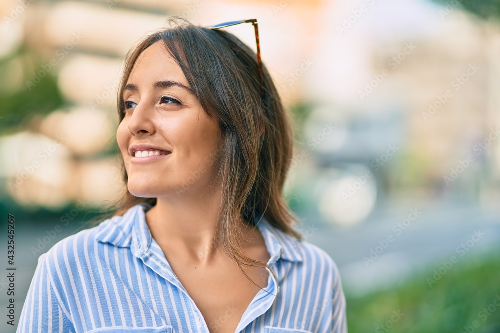 Young hispanic woman smiling happy standing at the city. Young hispanic woman smiling happy standing at the city.