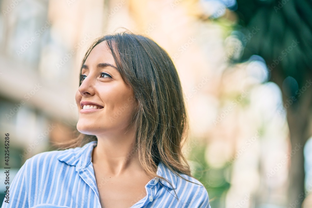 Young hispanic woman smiling happy standing at the city. Young hispanic woman smiling happy standing at the city.