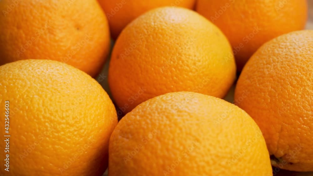 Oranges, close-up. Background of Ripe Oranges, Citrus Fruits. Fresh Crop. Vegetarian Diet. Oranges, close-up. Background of Ripe Oranges, Citrus Fruits. Fresh Crop. Vegetarian Diet.