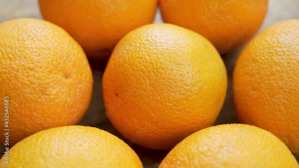 Spin Fresh Oranges, Citrus Tropical Fruits on the Wooden Surface. Juicy Whole Oranges Are Isolated. Background of Oranges. Healthy Vegetarian Food with Vitamin C. Spin Fresh Oranges, Citrus Tropical Fruits on the Wooden Surface. Juicy Whole Oranges Are Isolated. Background of Oranges. Healthy Vegetarian Food with Vitamin C.