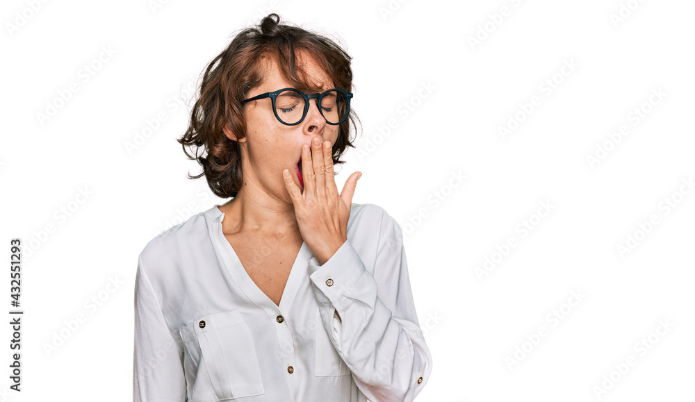 Young hispanic woman wearing business style and glasses bored yawning tired covering mouth with hand. restless and sleepiness. Young hispanic woman wearing business style and glasses bored yawning tired covering mouth with hand. restless and sleepiness.