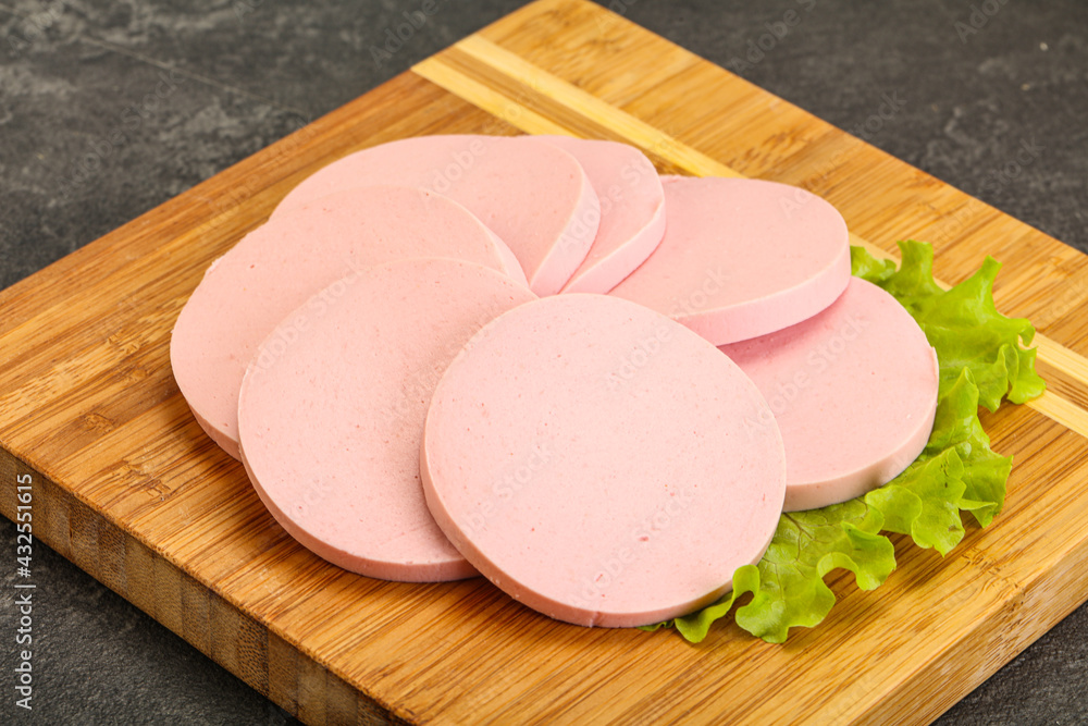 Sliced sausage snak over board Sliced sausage snak over board