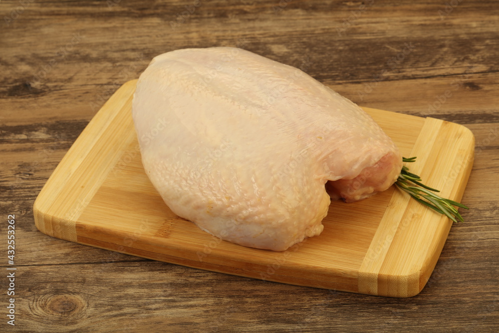 Raw whole chicken breast with skin Raw whole chicken breast with skin