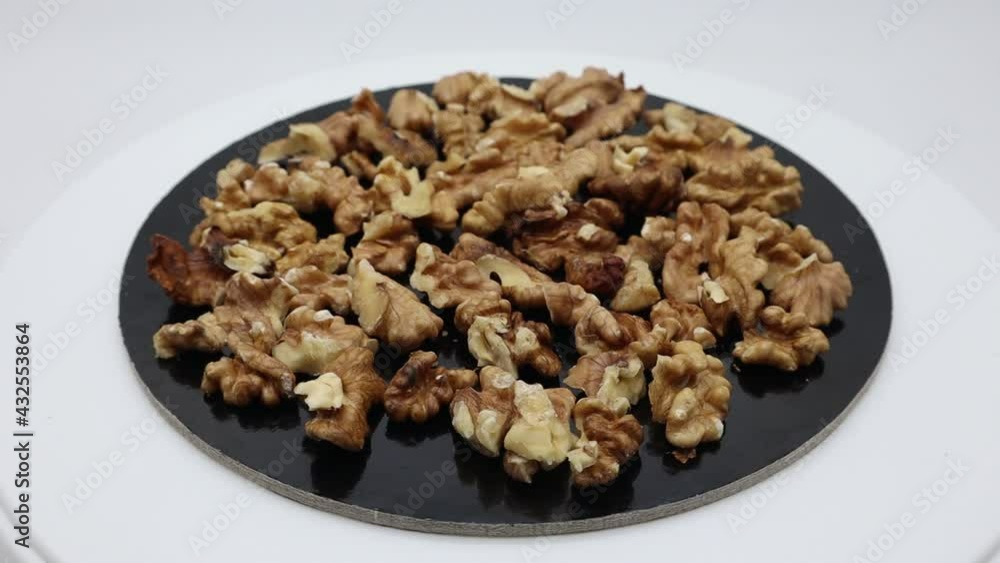 Walnut rotating pile out its shell isolated on white background Walnut rotating pile out its shell isolated on white background