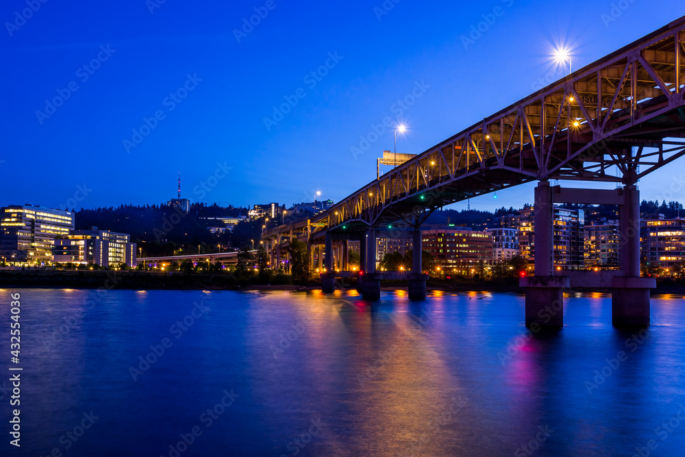 Colorful cityscape of Portland  over Willamette  river at twilight