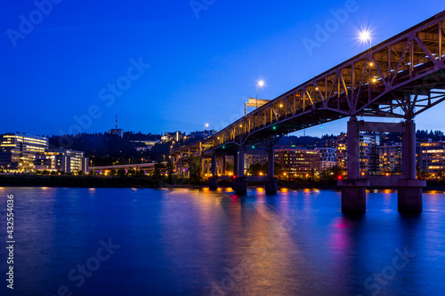Colorful cityscape of Portland over Willamette river at twilight