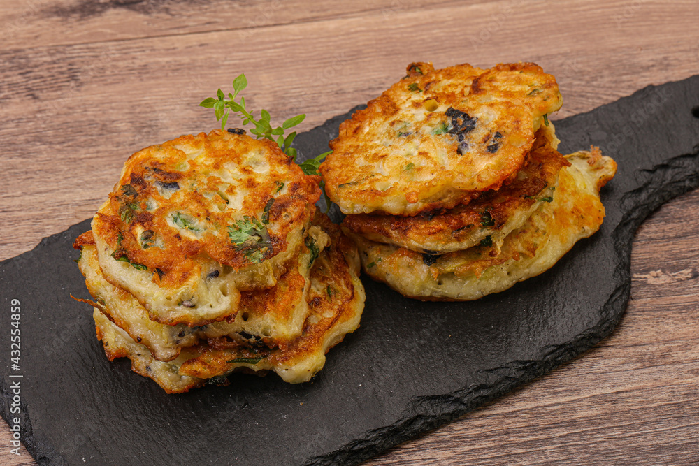Zucchini pancakes with herbs and spices Zucchini pancakes with herbs and spices