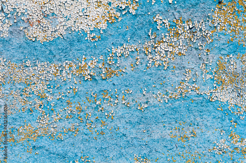 Photo of the texture of a battered wall. The wall is painted blue. Photo of the texture of a battered wall. The wall is painted blue.