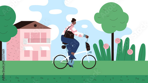 A person with shoulder bag riding a folding bicycle on the contry road on a sunny day. Town house trees and flowers on the background