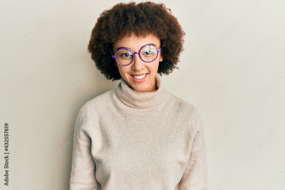Young hispanic girl wearing casual clothes and glasses with a happy and cool smile on face. lucky person. Young hispanic girl wearing casual clothes and glasses with a happy and cool smile on face. lucky person.