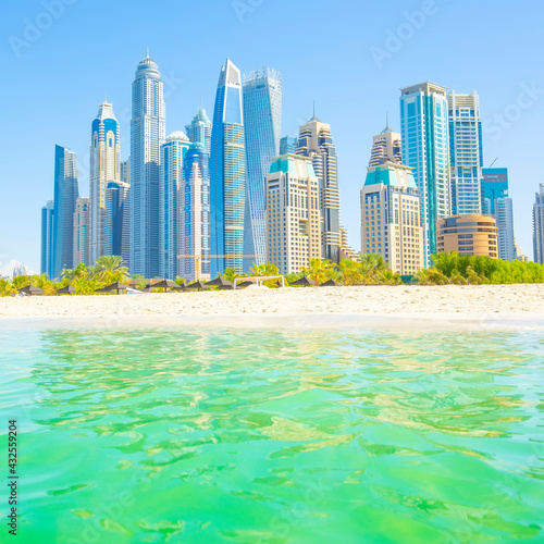 Dubai skyline, beach among skyscrapers, UAE