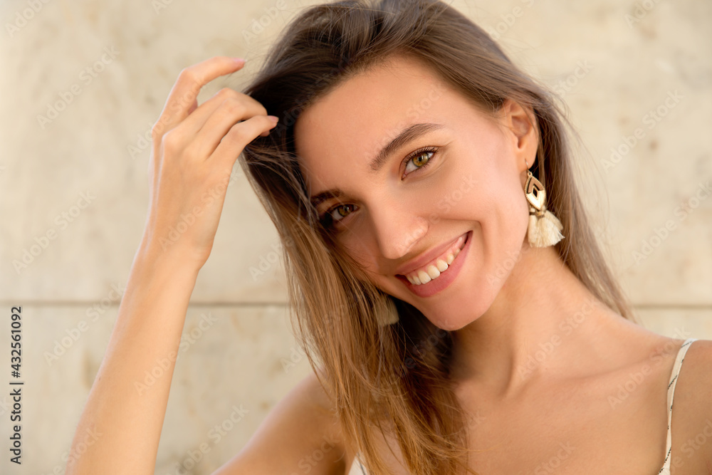 Beauty model with natural makeup smiling in the city. Beauty in the city and lifestyle concept. Beauty model with natural makeup smiling in the city. Beauty in the city and lifestyle concept.