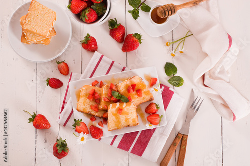 Lemon pund cake with honey and fresh strawberries. photo