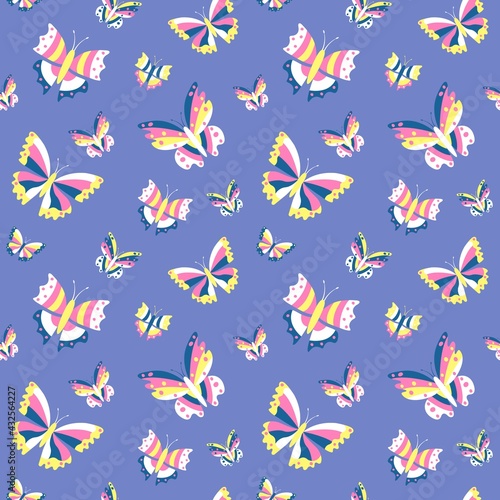 Seamless pattern with multicolored butterflies on a blue background. For the design of paper, wallpaper, textiles.