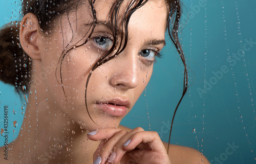 Wallpaper Mural Beautiful young woman with clean perfect skin and water moisture drops touching face. Torontodigital.ca