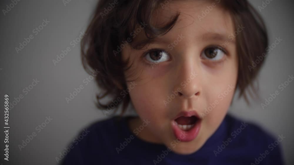 portrait of a boy in a blue T-shirt singing meow meow portrait of a boy in a blue T-shirt singing meow meow