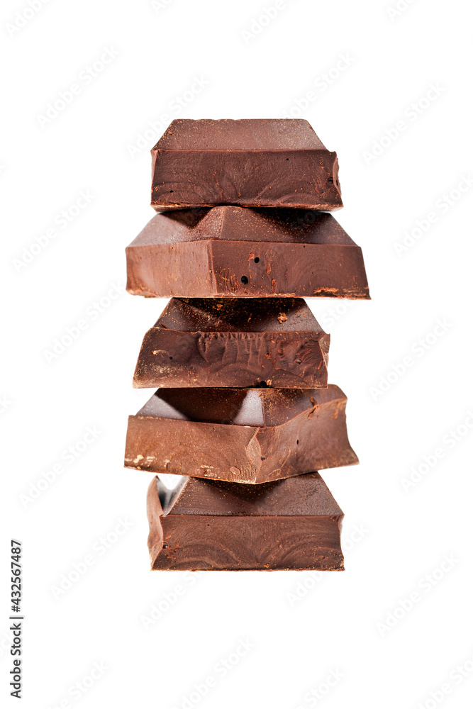 Stack of pieces of dark chocolate bar isolated on a white background