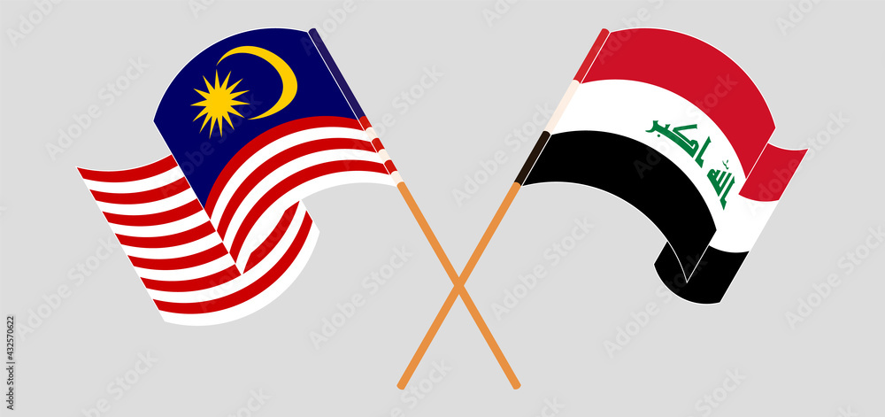Crossed and waving flags of Malaysia and Iraq Crossed and waving flags of Malaysia and Iraq