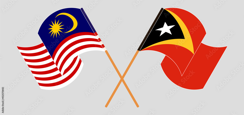Crossed and waving flags of Malaysia and East Timor Crossed and waving flags of Malaysia and East Timor