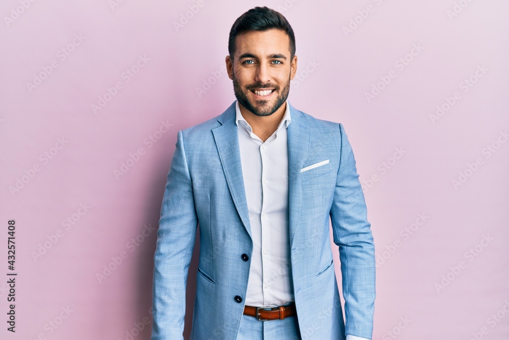 Young hispanic businessman wearing business jacket with a happy and cool smile on face. lucky person. Young hispanic businessman wearing business jacket with a happy and cool smile on face. lucky person.