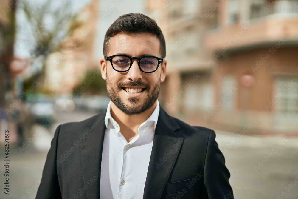 Young hispanic businessman smiling happy standing at the city. Young hispanic businessman smiling happy standing at the city.