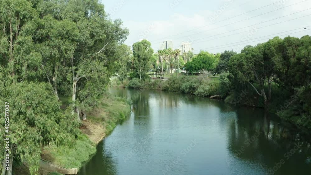 Aerial Shot Of Beautiful River At Yarkon Park In City, Drone Flying Upward - Tel Aviv, Israel Aerial Shot Of Beautiful River At Yarkon Park In City, Drone Flying Upward - Tel Aviv, Israel