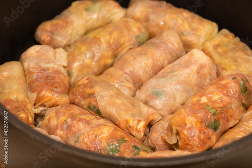 Romanian traditional food – Sarmale. Raw stuffed cabbage rolls with meat and rice in a pan ready for boiling  
