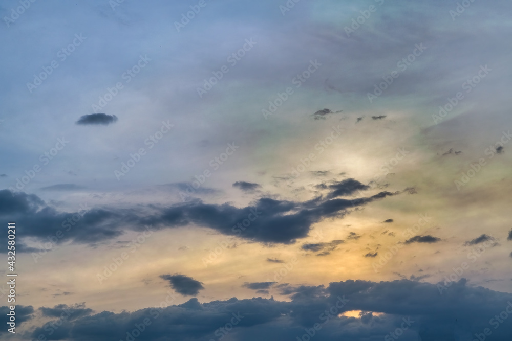 The sky at sunset. Cumulus clouds lit by the rays of the setting sun. The sky at sunset. Cumulus clouds lit by the rays of the setting sun.