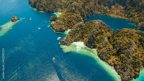 Fototapeta Naklejka Na Ścianę i Meble -  Aerial view mountain Barracuda lake, on tropical island, Lagoon with blue, azure water. Lake in the mountains covered with tropical forest on the island Coron, Palawan, Philippines.