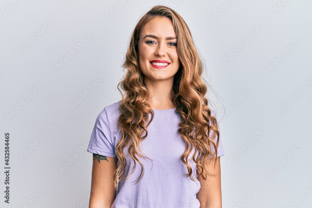 Young blonde girl wearing casual clothes with a happy and cool smile on face. lucky person. Young blonde girl wearing casual clothes with a happy and cool smile on face. lucky person.