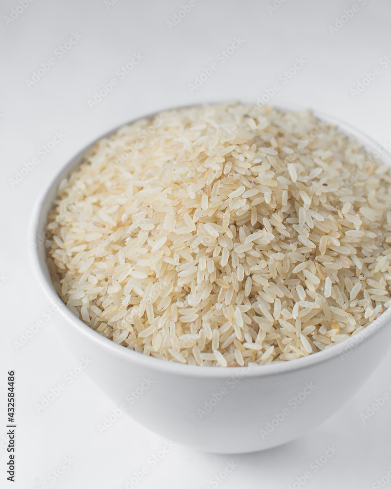 Raw rice in a white bowl Raw rice in a white bowl